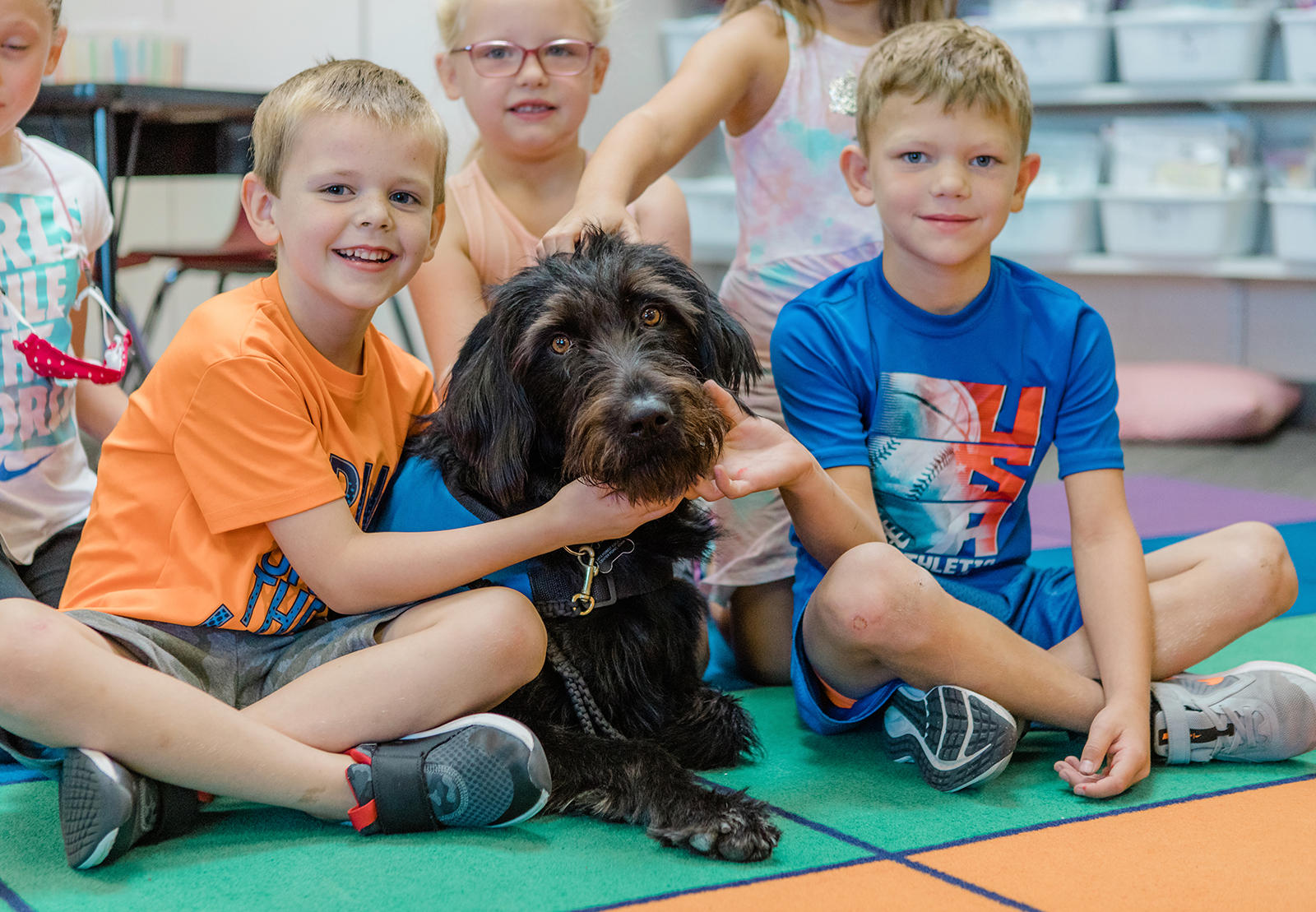 Primary students with Walker the therapy dog