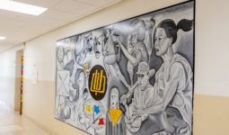 Mural in CPU middle school showing students participating in various activities